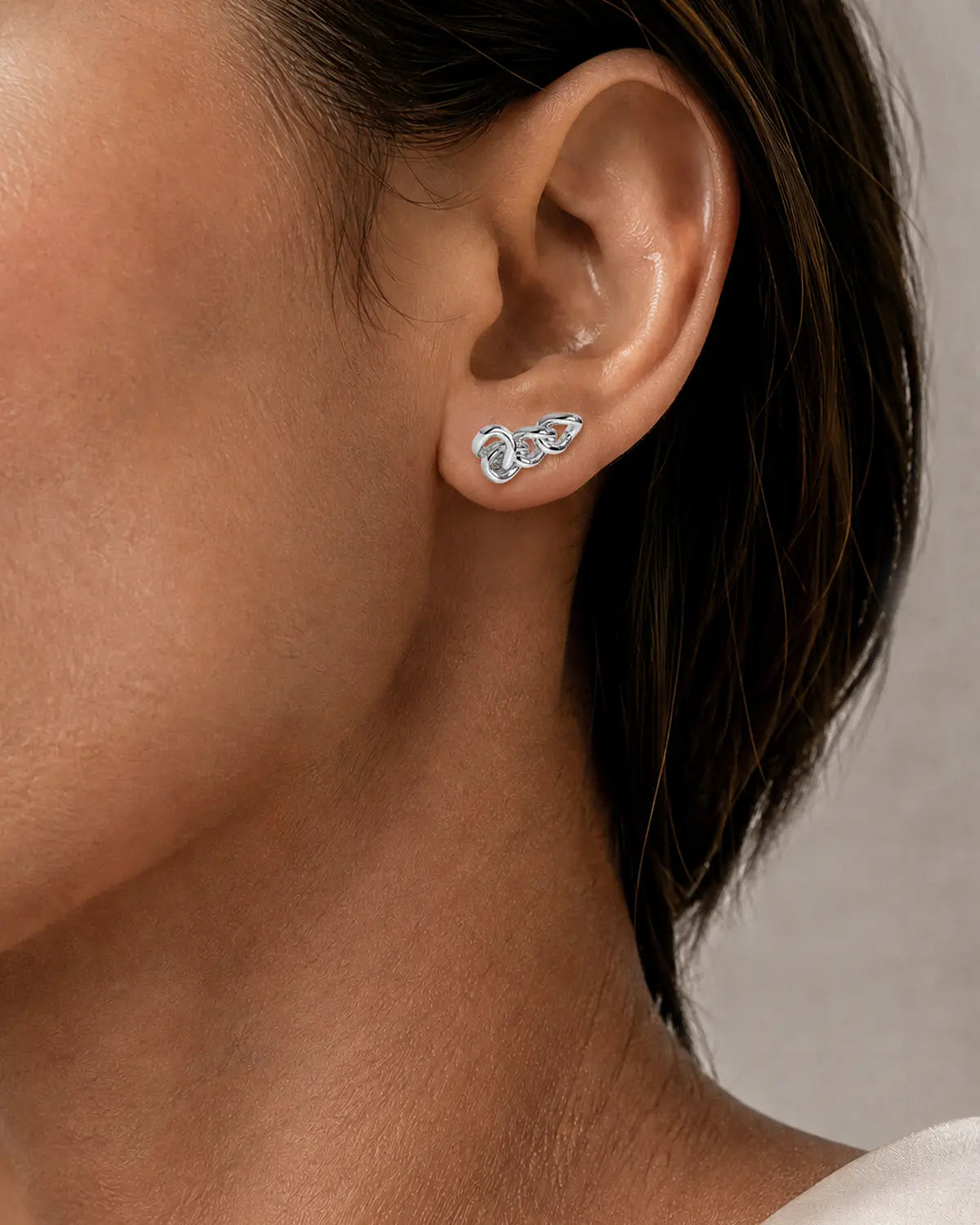 NEXUS INTERLINKED STUD EARRINGS